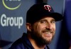 Minnesota Twins manager Rocco Baldelli smiles as he talks to a teammate during the first inning of the team's baseball game against the Tampa Bay Rays on Thursday, May 30, 2019, in St. Petersburg, Fla. Baldelli is a former player and coach for the Rays. (AP Photo/Chris O'Meara)