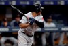 Boston Red Sox's Rafael Devers lines a two-run single off Tampa Bay Rays starting pitcher Charlie Morton during the third inning of a baseball game Wednesday, July 24, 2019, in St. Petersburg, Fla. Boston's Brock Holt and Mookie Betts both scored. (AP Photo/Chris O'Meara)