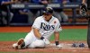 Tampa Bay Rays' Ji-Man Choi tries to catch his breath after he hit an RBI single off Toronto Blue Jays pitcher Jacob Waguespack and then scored on a throwing error by catcher Luke Maile during the fourth inning of a baseball game Monday, May 27, 2019, in St. Petersburg, Fla. (AP Photo/Chris O'Meara)
