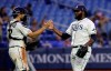 Tampa Bay Rays relief pitcher Diego Castillo, right, celebrates with catcher Travis d'Arnaud after closing out the Toronto Blue Jays during the ninth inning of a baseball game, Tuesday, May 28, 2019, in St. Petersburg, Fla. (AP Photo/Chris O'Meara)