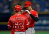 Los Angeles Angels' Shohei Ohtani, right, of Japan, celebrates with first base coach Jesus Feliciano after his single off Tampa Bay Rays' Hunter Wood, completing the cycle during the seventh inning of a baseball game Thursday, June 13, 2019, in St. Petersburg, Fla. (AP Photo/Chris O'Meara)