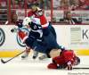 Chuck Myers / Tribune Media MCT
Winnipeg Jets defenseman Zach Bogosian upends Washington Capitals center Cody Eakin with a check during second-period action at the Verizon Center in Washington, D.C., Wednesday.