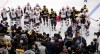 Ottawa Senators and Boston Bruins players watch as medical workers attend to Scott Sabourin, who was injured on a play with David Backes during the first period Saturday ion Boston. (Charles Krupa /  Asspociated Press files)