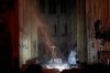 Smoke is seen in the interior of Notre Dame cathedral in Paris, Monday, April 15, 2019. A catastrophic fire engulfed the upper reaches of Paris' soaring Notre Dame Cathedral as it was undergoing renovations Monday, threatening one of the greatest architectural treasures of the Western world as tourists and Parisians looked on aghast from the streets below. (Philippe Wojazer/Pool via AP)