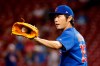 FILE - In this Aug. 23, 2017, file photo, Chicago Cubs relief pitcher Koji Uehara prepares to throw during the eighth inning of the team's baseball game against the Cincinnati Reds in Cincinnati. Uehara, whose dominant season in relief helped the Boston Red Sox win the 2013 World Series, has retired with Japan‚Äôs Yomiuri Giants, the team that he first played for in Japan. (AP Photo/John Minchillo, File)