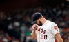 Houston Astros starting pitcher Wade Miley wipes his face as he walks toward the dugout after being pulled during the first inning of a baseball game against the Oakland Athletics Tuesday, Sept. 10, 2019, in Houston. (AP Photo/David J. Phillip)