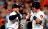 Houston Astros' George Springer, left, celebrates with Alex Bregman (2) after hitting a home run against the Pittsburgh Pirates during the first inning of a baseball game Wednesday, June 26, 2019, in Houston. (AP Photo/David J. Phillip)