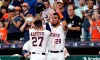 Houston Astros' Jose Altuve (27) is congratulated by Robinson Chirinos (28) after hitting a home run against the Detroit Tigers during the first inning of a baseball game Tuesday, Aug. 20, 2019, in Houston. (AP Photo/David J. Phillip)