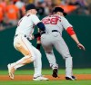 Boston Red Sox's J.D. Martinez (28) is tagged out by Houston Astros third baseman Alex Bregman (2) after being caught in a rundown during the seventh inning of a baseball game Saturday, May 25, 2019, in Houston. (AP Photo/David J. Phillip)