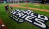 Houston Astros grounds crew members Jake Cooley, left, and Trey Feltch repaint the World Series logo for the baseball World Series at Minute Maid Park, Monday, Oct. 28, 2019. The Astros will play the Washington Nationals in Game 6 on Tuesday. (AP Photo/Eric Gay)