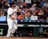 Houston Astros' Tyler White watches his solo home run off Chicago White Sox relief pitcher Jose Ruiz during the fourth inning of a baseball game, Monday, May 20, 2019, in Houston. (AP Photo/Eric Christian Smith)