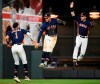Houston Astros' Carlos Correa (1), George Springer, center, and Josh Reddick celebrates the team's 11-4 win over the Texas Rangers in a baseball game, Saturday, May 11, 2019, in Houston. (AP Photo/Eric Christian Smith)
