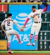 Houston Astros' Alex Bregman, left, and George Springer, right, celebrates the team's win over the Texas Rangers in a baseball game, Sunday, May 12, 2019, in Houston. (AP Photo/Eric Christian Smith)