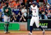 Houston Astros George Springer (4) celebrates as he crosses the plate in front of Oakland Athletics catcher Chris Herrmann, left, after Springer's two run home run during the third inning of a baseball game Wednesday, July 24, 2019, in Houston. (AP Photo/Michael Wyke)
