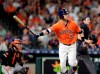 Houston Astros' Josh Reddick watches his home run during the fifth inning of the team's baseball game against the Baltimore Orioles on Friday, June 7, 2019, in Houston. (AP Photo/Michael Wyke)