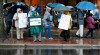 People demonstrate outside in Richmond, Va., to support The U.S. Department of Housing and Urban Development and Bureau of Prisons employees who are affected by the partial government shut down Thursday, Jan. 24, 2019. (Alexa Welch Edlund/Richmond Times-Dispatch via AP)