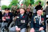 Canadian veterans Al Roy, center, Hugh Patterson, right, attend a French-Canadian ceremony to commemorate the Poche de Falaise battle in Chambois, Normandy, Tuesday, June 4, 2019. D-Day marked only the beginning of the Allied struggle to wrest Europe from the Nazis. A commemoration Tuesday served as a reminder of this, in the shadow of bigger D-Day 75th anniversary commemorations. (AP Photo/David Vincent)