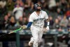 Seattle Mariners' Omar Narvaez tosses his bat after hitting a solo home run off Chicago White Sox relief pitcher Alex Colome during the 10th inning of a baseball game, Saturday, Sept. 14, 2019, in Seattle. The Mariners won 2-1. (AP Photo/Stephen Brashear)