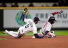 Seattle Mariners second baseman Dee Gordon goes to the ground after tagging out Minnesota Twins' Jorge Polanco, who tried to stretch a single into a double during the fourth inning of a baseball game Thursday, May 16, 2019, in Seattle. (AP Photo/Stephen Brashear)
