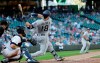 San Diego Padres' Austin Hedges follows through on a swing during the fourth inning of a baseball game against the Seattle Mariners, Wednesday, Aug. 7, 2019, in Seattle. Hedges popped out on the at-bat. (AP Photo/Ted S. Warren)