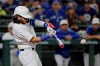 Toronto Blue Jays' Bo Bichette hits an RBI single to score Billy McKinney during the seventh inning of the team's baseball game against the Seattle Mariners, Saturday, Aug. 24, 2019, in Seattle. (AP Photo/Ted S. Warren)