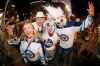 THE CANADIAN PRESS/John Woods
Winnipeg Jet fans celebrate at Portage and Main in downtown Winnipeg after the Winnipeg Jets defeated the Minnesota Wild in game five NHL playoff action to win the first round 4-1 in Winnipeg on Friday, April 20, 2018.