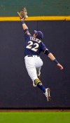 Milwaukee Brewers' Christian Yelich can't catch a triple by Minnesota Twins' Ehire Adrianza during the sixth inning of a baseball game Wednesday, Aug. 14, 2019, in Milwaukee. (AP Photo/Jeffrey Phelps)