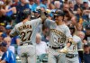Pittsburgh Pirates' Kevin Newman is congratulated by Bryan Reynolds after hitting a home run during the third inning of a baseball game against the Milwaukee Brewers Friday, June 28, 2019, in Milwaukee. (AP Photo/Morry Gash)