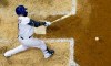 Milwaukee Brewers' Eric Thames hits an RBI single during the sixth inning of a baseball game against the San Francisco Giants Friday, July 12, 2019, in Milwaukee. (AP Photo/Morry Gash)