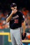 Washington Nationals starting pitcher Max Scherzer wipes his face during the first inning of Game 1 of the baseball World Series against the Houston Astros Tuesday, Oct. 22, 2019, in Houston. (AP Photo/Matt Slocum)