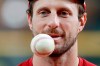 Washington Nationals starting pitcher Max Scherzer warms up during batting practice for baseball's World Series Monday, Oct. 21, 2019, in Houston. The Houston Astros face the Washington Nationals in Game 1 on Tuesday. (AP Photo/Eric Gay)