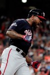 Washington Nationals' Howie Kendrick celebrates after hitting a two-run home run during the seventh inning of Game 7 of the baseball World Series against the Houston Astros Wednesday, Oct. 30, 2019, in Houston. (AP Photo/David J. Phillip)