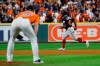 Houston Astros relief pitcher Will Harris watch as Washington Nationals' Howie Kendrick reacts after hitting a two-run home run during the seventh inning of Game 7 of the baseball World Series Wednesday, Oct. 30, 2019, in Houston. (AP Photo/Matt Slocum)