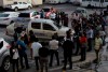 Journalists surround the police vehicle carrying Eddy Vladimir Féliz Garcia who was taken into custody in connection with the shooting of former Boston Red Sox slugger David Ortiz, as he is taken to court in Santo Domingo, Dominican Republic, Tuesday, June 11, 2019. His lawyer, Deivi Solano, said Féliz Garcia had no idea who he’d picked up and what was about to happen, and that he expected Féliz Garcia would be charged as an accomplice to an attempted murder. (AP Photo/Roberto Guzman)