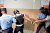 Police officers escort suspects implicated in the shooting of former Boston Red Sox slugger David Ortiz, VÃ­ctor Hugo GÃ³mez VÃ¡zquez, left, and Alberto RodrÃ­guez Mota, right, out of the courtroom in Santo Domingo Este, Dominican Republic, Saturday, June 29, 2019. Ortiz was shot in the back at a bar in the Dominican Republic on Sunday, June 9. (AP Photo/Tatiana Fernandez)