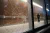 Daniel Crump / Winnipeg Free Press. A security officer walks by a broken window near the Adult Emergency entrance at Health Sciences Centre. February 28, 2018.