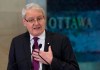 Transport Minister Marc Garneau speaks about passenger rights during a news conference at the airport in Ottawa, Monday December 17, 2018. THE CANADIAN PRESS/Adrian Wyld