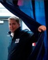 Conservative leader Andrew Scheer pulls back a curtain as he arrives at a campaign office in Vancouver, Sunday October 20, 2019. THE CANADIAN PRESS/Adrian Wyld