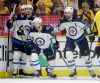 Winnipeg Jets left wing Kyle Connor (81) celebrates with Josh Morrissey, Mark Scheifele and Blake Wheeler, from left, after Connor scored a goal against the Nashville Predators during the second period in Game 5 of an NHL hockey second-round playoff series Saturday, May 5, 2018, in Nashville, Tenn. (AP Photo/Mark Humphrey)