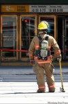 TREVOR.HAGAN@FREEPRESS.MB.CA / WINNIPEG FREE PRESS
A firefighter waits to enter The Bay on Memorial Boulevard. A fire started in the sewer system next to the store and spread into the basement.