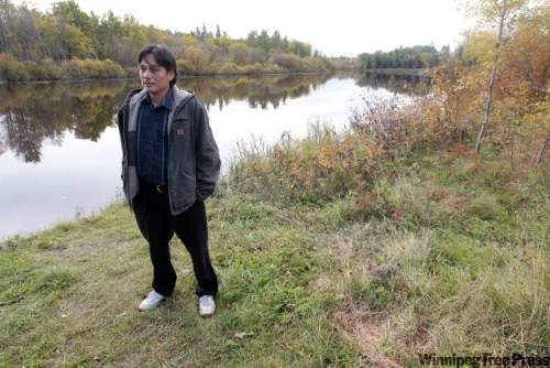 JOE.BRYKSA@FREEPRESS.MB.CA
Coun. Denelle Bushie stands by the Wanipigow River, the source for drinking water for Hollow Water First Nation.