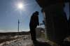 JOE.BRYKSA@FREEPRESS.MB.CA
Clyde Lonefoot, 19, gets a pail of treated water at a fresh water delivery station. Many people in St. Theresa Point must haul clean water to their homes each day.