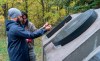 NDP Leader Jagmeet Singh makes an offering of tobacco at the monument to the local victims of residential schools on the Grassy Narrows First Nation in northwestern Ontario on Saturday, October 5, 2019. THE CANADIAN PRESS/Paul Chiasson