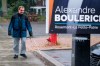 Jerome Plante, who is visually impaired, walks along a sidewalk towards a low-hanging election sign in Montreal on Tuesday, October 1, 2019. An advocacy group for the visually impaired is calling out political parties for their low-hanging Montreal election signs that create a hazard for those unable to see them. THE CANADIAN PRESS/Paul Chiasson
