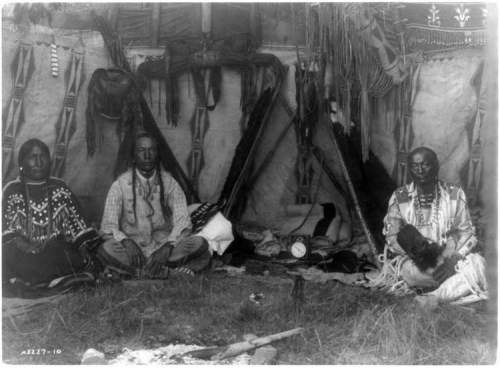 Edward S. Curtis / Library of Congress
Little Plume and son Yellow Kidney with a Victorian clock between them. Photographer Edward Curtis doctored the photo to remove the clock when he published this photo in 1910 in order to produce an 'authentic' depiction.