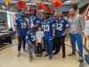 During his time at Children's Hospital, eight-year-old Quinn Brown (centre) met several Winnipeg Blue Bombers players and bonded with Winston Rose. (Supplied photo)