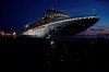 Journalists work near the quarantined Diamond Princess cruise ship sitting at the Yokohama Port Monday, Feb. 10, 2020, Yokohama, Japan. The operator of the ship said Monday that an additional 66 cases were found aboard. That is in addition to 70 reported earlier. (AP Photo/Eugene Hoshiko)