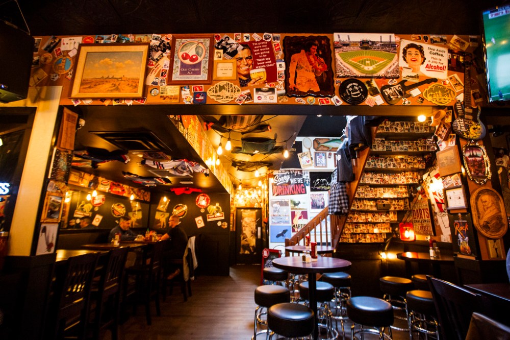 The walls of Leopold's Tavern in South Osborne are filled with various stickers and posters. (Mikaela MacKenzie / Winnipeg free Press files)