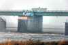 Water pours over the floodway control gates that rise from the bottom of the river as the floodway is in operation on Oct. 10. (Phil Hossack / Winnipeg Free Press files)