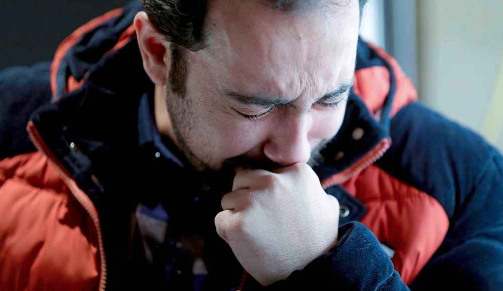 Morteza Tavalkoli, grieves the loss of his best friend, Amir Ghasemi, during vigil at UMSU on Wednesday. (Ruth Bonneville / Winnipeg Free Press)